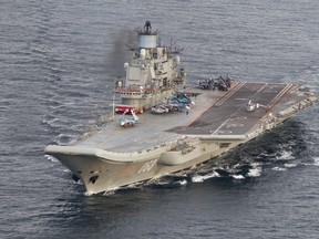 This October 17, 2016 Norwegian Armed Forces handout image shows the Russian aircraft carrier Admiral Kuznetsov passing the Norwegian island of Andoya in international waters on its way to the mediterranean
