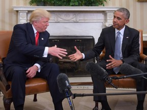 President Barack Obama and Republican President-elect Donald Trump shake hands during a transition planning meeting in the Oval Office at the White House on November 10, 2016 in Washington, DC