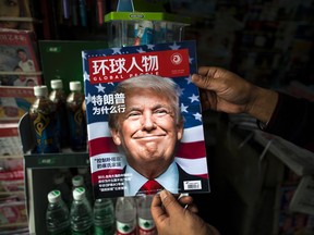 A copy of the local Chinese magazine Global People with a cover story that translates to "Why did Trump win"