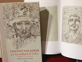 This picture taken on November 15, 2016, shows a book of drawings from Dutch post-impressionist painter Vincent Van Gogh displayed during a press conference at the architecture academy in Paris.
