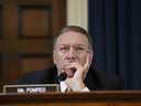 This file photo taken on October 22, 2015 shows Republican US Representative from Kansas Mike Pompeo listening as former US Secretary of State and Democratic Presidential hopeful Hillary Clinton testifies before the House Select Committee on Benghazi on Capitol Hill in Washington, DC.