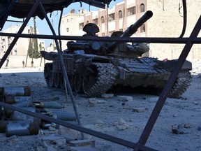 A tank is seen on a street on November 27, 2016 in the Masaken Hanano district in eastern Aleppo, a day after Syrian pro-government forces took it from rebel fighter