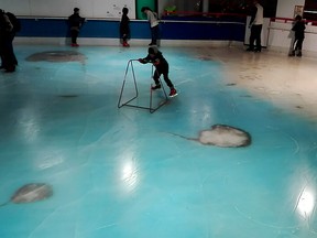 The handout picture released on November 28 shows people skating on an ice rink with 5,000 frozen dead fish inside at the Space World amusement park in Kitakyushu, southwestern Japan.  The park operator closed its ice rink on November 27 after drawing a barrage of criticism.