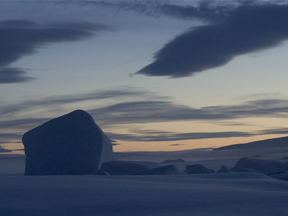 Spectacular scenery made up from ice, snow, icebergs and 24 hours of darkness just north of Alert above frozen Arctic Ocean only 490 miles from North Pole.