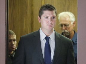 Ray Tensing arrives at court on the fourth day of jury deliberations in his murder trial, Saturday, Nov. 12, in Cincinnati.  Judge Megan Shanahan has declared a mistrial, after the jury said it was deadlocked in the case.  Tensing, the former University of Cincinnati police officer is charged with murdering Sam DuBose while on duty during a routine traffic stop on July 19, 2015.