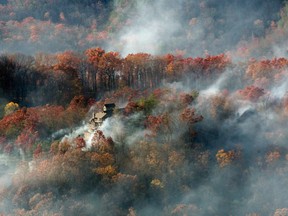 Burned structures are seen from aboard a National Guard helicopter near Gatlinburg, Tenn., on Tuesday, Nov. 29, 2016.