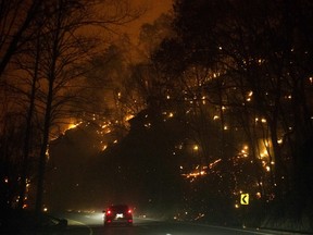 Fire erupts on both side of Highway 441 near The Spur on Monday, Nov. 28, 2016.