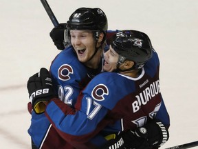 Gabriel Landeskog, left, and Rene Bourque of the Colorado Avalanche congratulate each other after Bourque is given credit for the game-winning goal in Friday's 3-2 victory over the Winnipeg Jets in  NHL action in Denver.