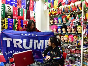 A woman displays a Trump banner in Jinhua, China. Beijing is already embroiled with its first dispute with the new administration.