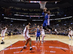 Philadelphia 76ers forward Richaun Holmes (right) slam dunks the ball past Toronto Raptors guard Cory Joseph on Nov. 28.