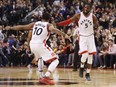 DeMarre Carroll is congratulated by Raptors teammate DeMar DeRozan for a three-pointer against the Memphis Grizzlies during the second half of their game in Toronto, on Wednesday night.