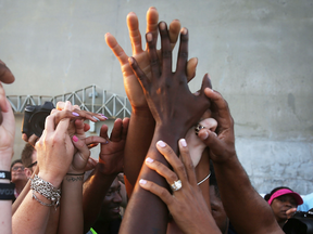 People hold hands as they commemorate the nine lives lost in the June 2015 shooting of black parishioners at Emanuel African Methodist Episcopal Church in Charleston, South Carolina.