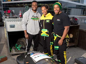 eldwyn Morgan, Jazmine Fenlator-Victorian and Surf Fenlator-Victorian prepare to package up a bobsled for transport to Whistler after training at Canada Olympic Park in Calgary on November 13, 2016