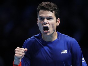 Milos Raonic celebrates winning match point against Dominic Thiem at the ATP Finals on Nov. 17.