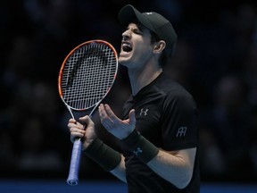 Andy Murray of Britain shouts after a return to Milos Raonic of Canada during their ATP World Tour Finals semifinal match at the O2 Arena in London on Saturday.