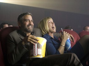 George Clooney and Frances McDormand laughing it up at a movie in Burn After Reading. Meta.
