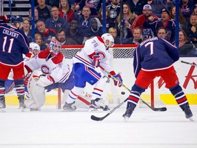 Montreal Canadiens' defenceman Andrei Markov tries to clear the puck out of harm's way to no avail during NHL action Friday night against the Columbus Blue Jackets. The goal by Josh Anderson (not shown) was one of 10 on the night against Montreal backup goaltender Al Montoya, setting a new franchise record for the Blue Jackets. The 10-0 defeat matched the most lopsided margin in Canadiens history. In 1995,the Canadiens lost 11-1 to the Detroit Red Wings.