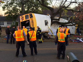Chattanooga Fire Department personnel work the scene of a fatal elementary school bus crash in Chattanooga, Tenn., Monday, Nov. 21, 2016.