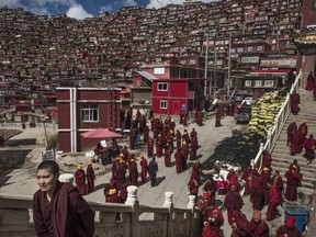 Monks in gather in Larung Gar, China, the world’s largest Buddhist institute.