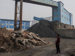 Allan Zhang, an electrician, where he works at a coal plant which recently resumed production to meet increased demand before winter snows arrive in Jinching, China, Nov. 20, 2016