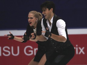 Kaitlyn Weaver and Andrew Poje of Canada compete in the Ice Dance Short Dance during the Audi Cup of China ISU Grand Prix of Figure Skating 2016 held in Beijing's Capital Gymnasium in Beijing, China, Friday, Nov. 18, 2016.