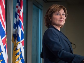 British Columbia Premier Christy Clark listens to a question while responding to the federal government approval of the Kinder Morgan Trans Mountain Pipeline expansion project, during a news conference in Vancouver, B.C., on Wednesday Nov. 30, 2016.
