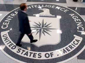 A man crosses the lobby of the CIA's headquarters in Langley, Va., in an Aug. 14, 2008 file photo.