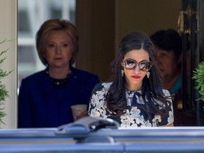 Top Clinton aide Huma Abedin walks ahead of Democratic presidential candidate Hillary Clinton following a private meeting at Clinton's home in Washington on June 10.