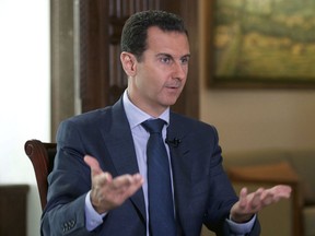 Syrian President Bashar Assad speaks to The Associated Press at the presidential palace in Damascus, September 2016