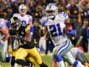 Dallas Cowboys running back Ezekiel Elliott beats Pittsburgh Steelers strong safety Robert Golden to the end zone for a touchdown during the second half of an NFL football game in Pittsburgh on Nov. 13, 2016.