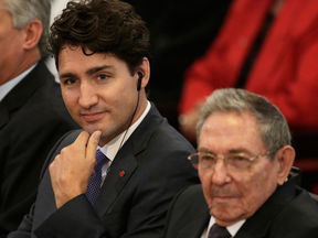 Prime Minister Justin Trudeau sits with Cuba's President Raul Castro at Havana University on Wednesday, Nov. 16, 2016.