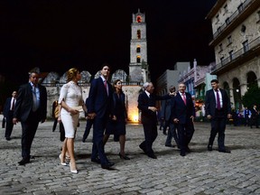 Prime Minister Justin Trudeau and Sophie Gregoire-Trudeau are accompanied by Cuban President Raul Castro through Plaza de San Francisco in Havana.