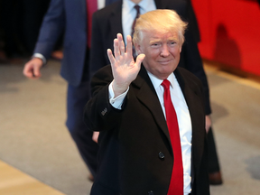 President-elect Donald Trump walks through the lobby of the New York Times following a meeting with editors at the paper on Nov. 22, 2016 in New York City.