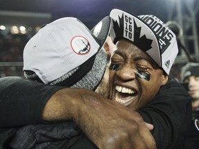 Ottawa Redblacks quarterback Henry Burris (right) celebrates after defeating the Calgary Stampeders in the Grey Cup on Nov. 27.