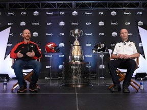 Calgary Stampeders head coach Dave Dickenson (left) and Ottawa Redblacks head coach Rick Campbell speak to reporters in Toronto on Nov. 23.