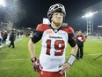 Calgary Stampeders quarterback Bo Levi Mitchell walks off the field after losing the Grey Cup in overtime on Nov. 27, 2016.