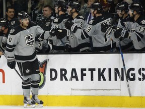 Devin Setoguchi celebrates with his Kings teammates after scoring against the Calgary Flames during the first period of their game in Los Angeles on Saturday night.