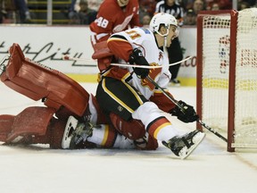 Calgary Flames centre Mikael Backlund scores the game-winning goal on Detroit Red Wings goalie Jimmy Howard in the third period Sunday at Joe Louis Arena in Detroit. Calgary won 3-2.