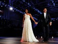 President Barack Obama and First Lady Michelle Obama enter the Neighborhood Ball in Washington, D.C., on Jan. 21, 2009, for a dance. MUST CREDIT:  photo by