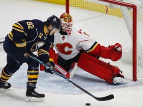 Marcus Foligno of the Buffalo Sabres gets in position to attempt a backhander against Calgary Flames' goaltender Brian Elliott during NHL action Monday night in Buffalo. The Sabres were 4-2 winners.