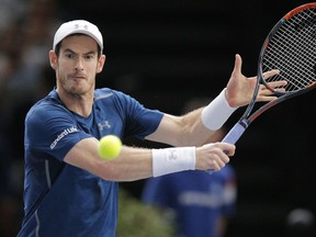Andy Murray returns the ball to John Isner during the final of the Paris Masters on Nov. 6.