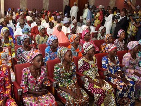 The 21 girls who were released by Boko Haram recently are shown meeting with   President Muhammadu Buhari, who Monday ordered Nigeria's police chief and state governors to investigate reports of officials abusing women and girls rescued from Boko Haram.