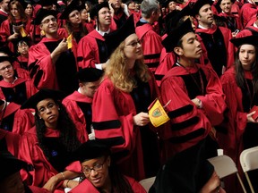 Harvard University students attend commencement ceremonies in Harvard Yard in Cambridge, Massachusetts.