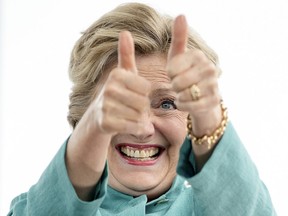 Democratic presidential candidate Hillary Clinton gives two thumbs up as she takes the stage to speak at a rally at C.B. Smith Park in Pembroke Pines, Fla., on Nov. 5.