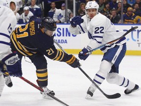Toronto Maple Leafs defenceman Nikita Zaitsev (right) defends against Buffalo Sabres forward Kyle Okposo on Nov. 3.