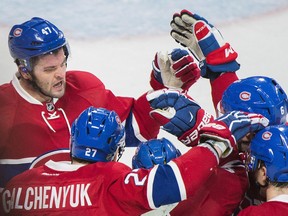 Montreal Canadiens players celebrate a goal from forward Paul Byron (centre) on Nov. 19.