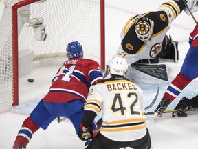 Paul Byron of the Canadiens scores the winning goal against Boston Bruins goalie Zane McIntyre during third period NHL action on Tuesday night in Montreal.