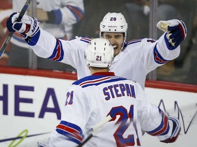New York Rangers' Derek Stepan celebrates his goal with teammate Chris Kreider during second period action against the Flames in Calgary on Saturday night.