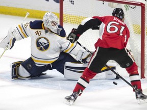 Buffalo Sabres goalie Robin Lehner stops the Senators' Mark Stone from scoring during second period NHL action Saturday night in Ottawa.