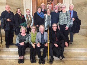 BCTF President Glen Hansman, seated wearing glasses and a black shirt outside the Supreme Court of Canada entrance, with retired teachers and their spouses who travelled to Ottawa for Thursday’s hearing and decision.